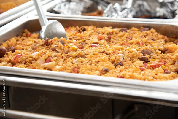 Fototapeta rice with sausage served on a tray