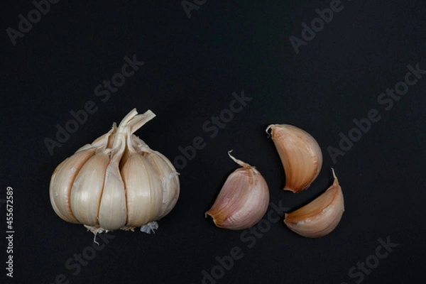 Fototapeta garlic placed on a black background