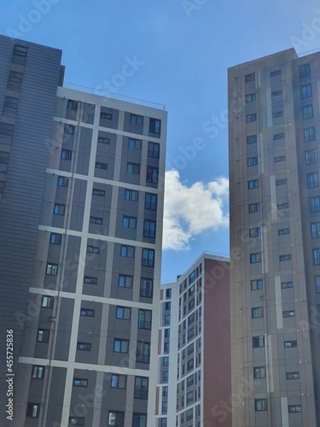 Fototapeta Architecture, sky and architecture. Background, clouds., sunny weather
