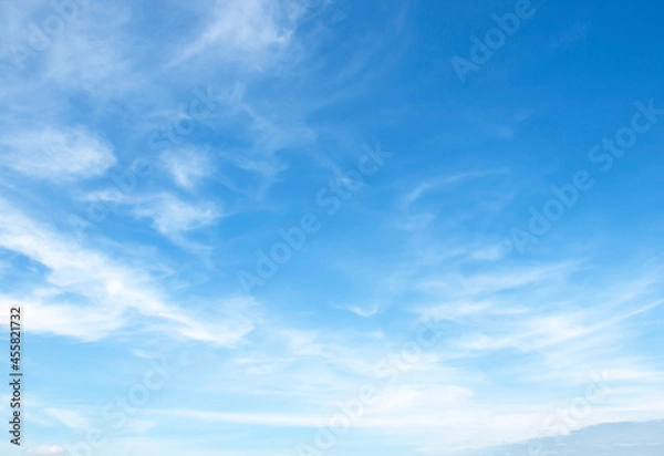 Fototapeta Blue sky background and white clouds soft focus, and copy space horizontal shape