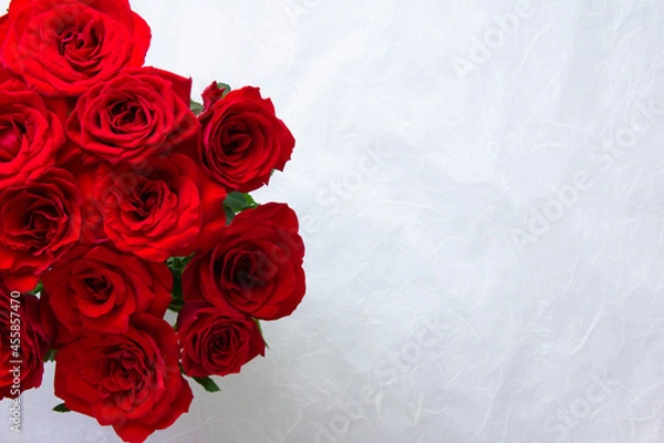 Obraz photo of a bouquet of red roses with a copy space on the right.