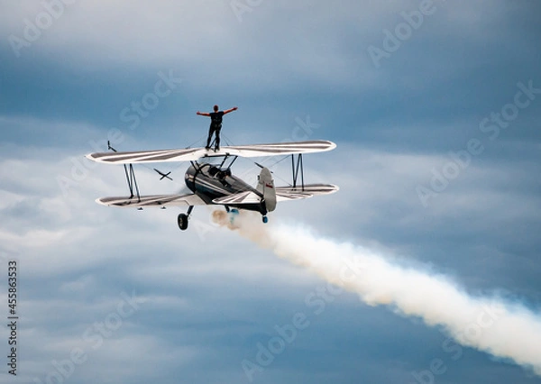 Obraz Wing Walking on Top of a Biplane