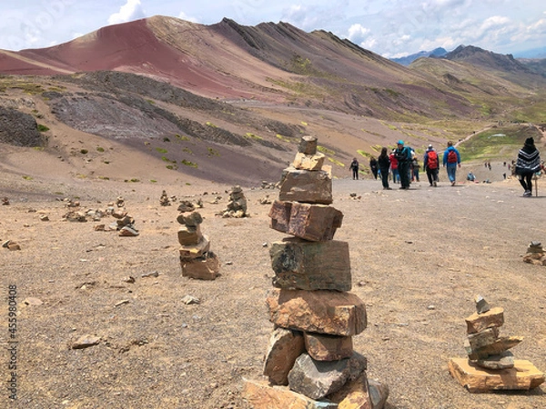 Fototapeta [Peru] Stacked stones at the  trail of Vinicunca mountain (Rainbow mountain)
