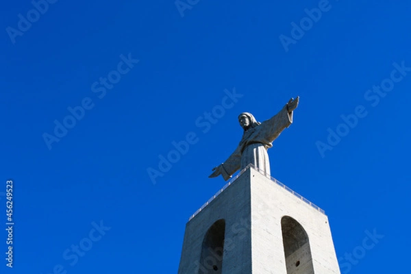Obraz View from below to the monument Cristo Rei, Portugal. Clean blue sky. Sanctuary of Christ the King. Catholic monument.
