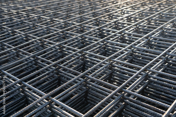 Fototapeta The rebar is bonded with steel wire for use as a construction infrastructure. Which part of the rebar has rusted due to chemical reactions.