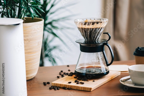 Obraz Alternative coffee brewing method, using pour over dripper and paper filter.