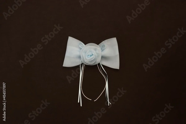 Obraz Light blue ribbon on black