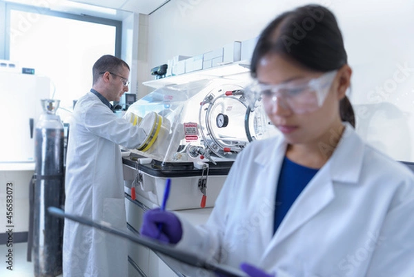 Fototapeta Scientists working in crystal engineering research laboratory