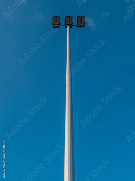Obraz Reflector light pole on blue sky background