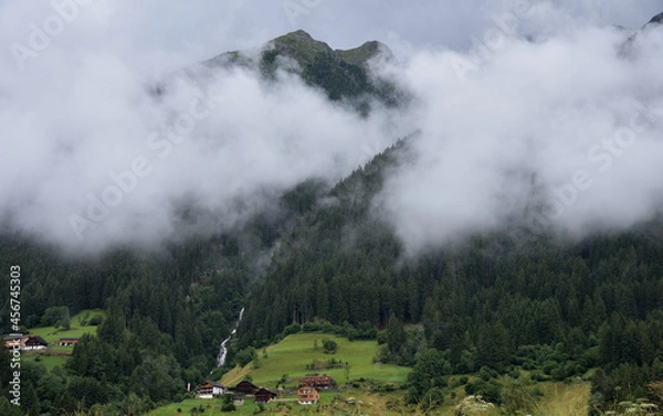 Obraz Clouds over the forest of the waterfall