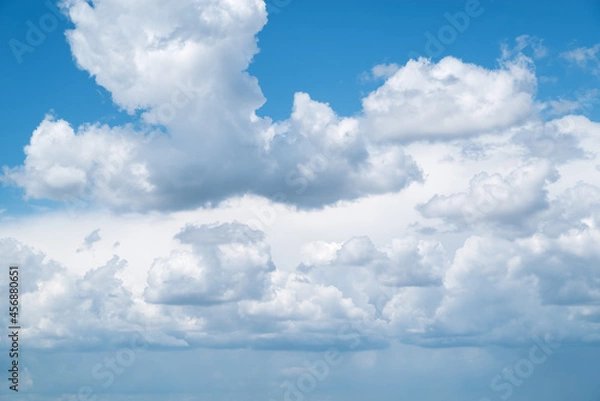 Fototapeta Heavenly landscape with cumulus clouds taken on a summer day in central Russia