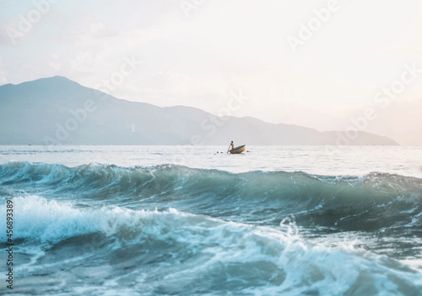Obraz Azure wave in the ocean. Asian fishing boat in the sea in Vietnam.