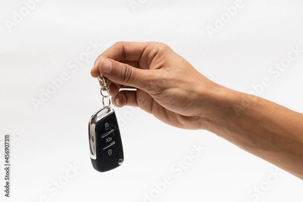 Obraz hand holding car remote isolated on white background 