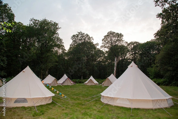 Obraz Glamping teepees in a circle in a field