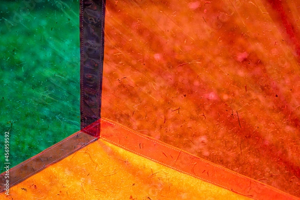 Obraz Close up focus view of colorful panels with grass and dirt debris. Abstract background. 