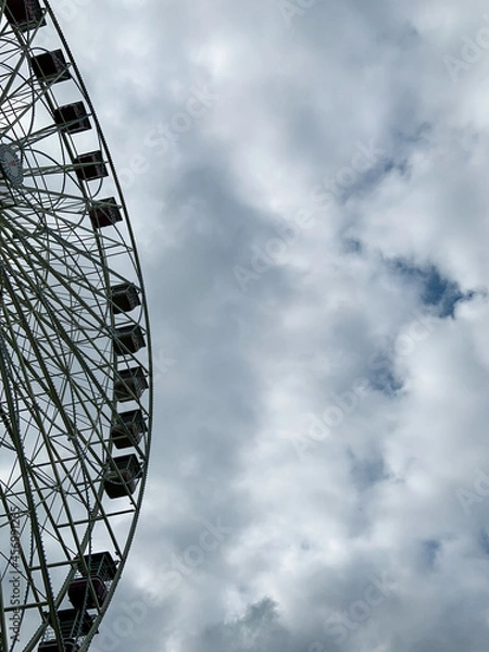 Obraz Ferris wheel against sky background, left aligned. 