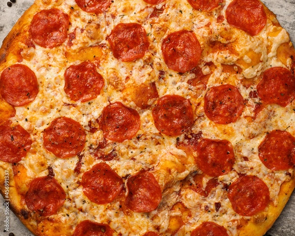 Fototapeta delicious pizza close-up. food texture, background for design.