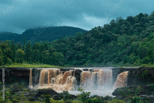 Obraz Vertical image of Gira waterfall and green mountain at Waghai, Saputara, Gujarat, India. Beautiful natural landscape