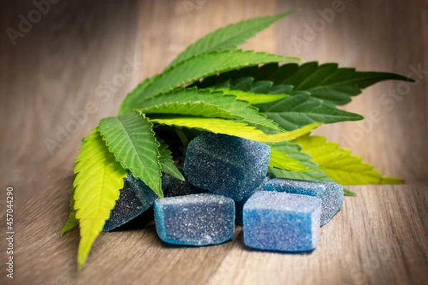 Fototapeta Blue Raspberry CBD Gummies with Hemp Leaf