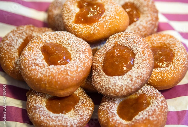 Fototapeta Plate of Fresh Homemade Fried Donuts with jam top view