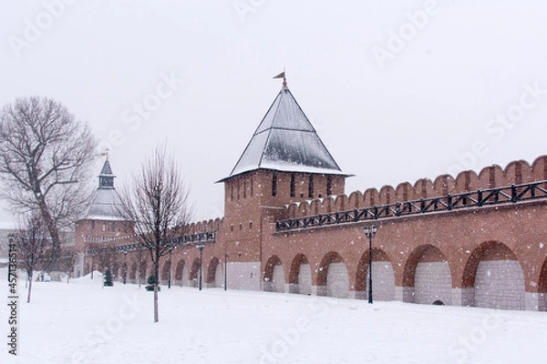 Fototapeta Russia, Tula. January 9, 2021. Red brick walls and towers of the Tula Kremlin in winter.