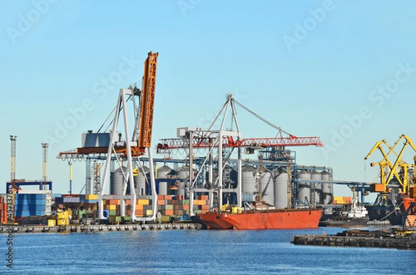 Obraz Container stack and ship under crane bridge