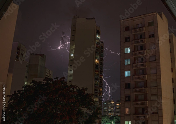 Obraz lightning behind a building
