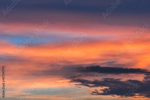 Fototapeta Colorful sunset background on a beautiful summer sky with clouds texture after rain