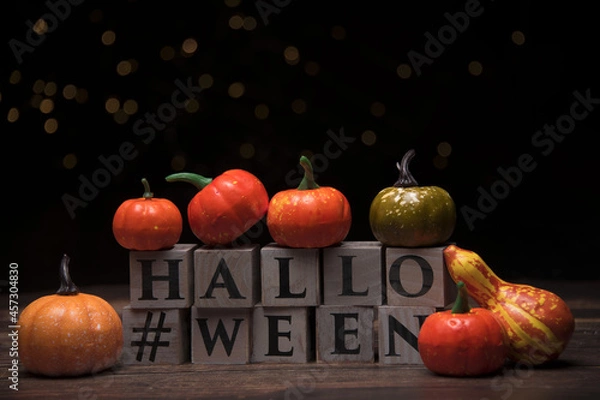 Obraz Various toy pumpkins for Halloween against on wooden cubes