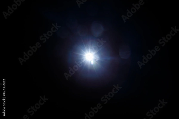 Obraz Easy to add lens flare effects for overlay designs or screen blending mode to make high-quality images. Abstract sun burst, digital flare, iridescent glare over black background.