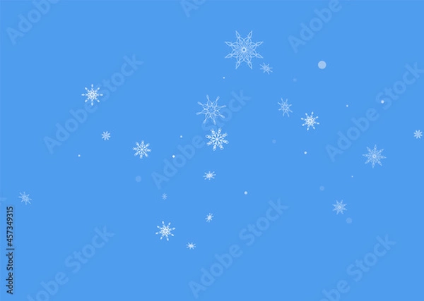 Fototapeta White delicate openwork snowflakes are scattered on a blue background. Festive background, postcard design, wallpaper