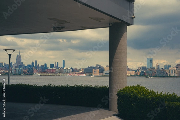 Obraz View of Manhattan skyline from underneath building cantilever with columns. 