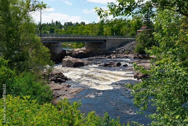 Fototapeta river passing under the bridge-