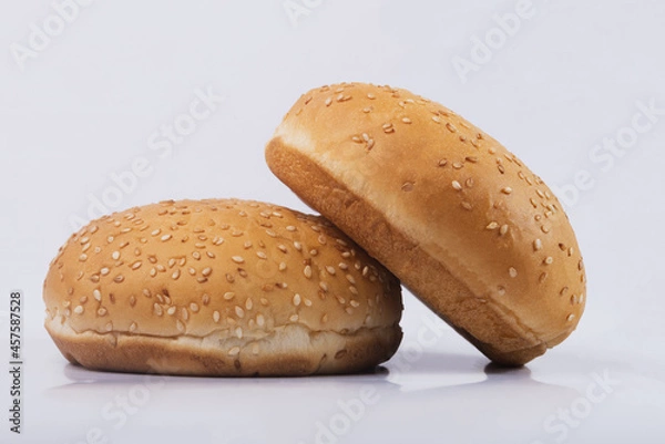 Fototapeta Cheeseburger bun on white isolated background. Two Hamburger buns with sesame isolated on white background