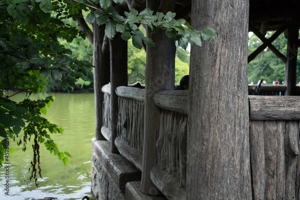Obraz View from behind left side of a park gazebo, overlooking lake. 