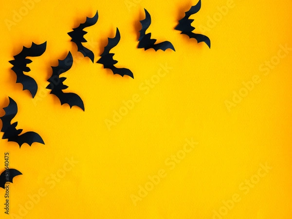 Fototapeta Halloween background. Bats on an orange background. Smooth layout.