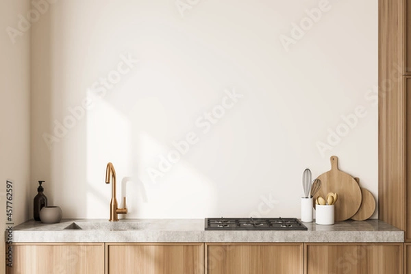 Fototapeta Close view on bright kitchen room interior with white wall