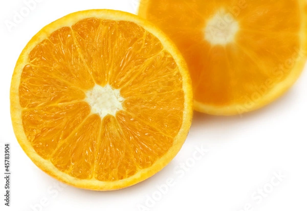 Fototapeta Sliced oranges with selective focus over white background