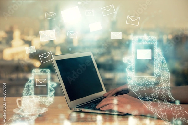 Fototapeta Double exposure of woman hands typing on computer and flying envelop drawing. E-Mail concept.