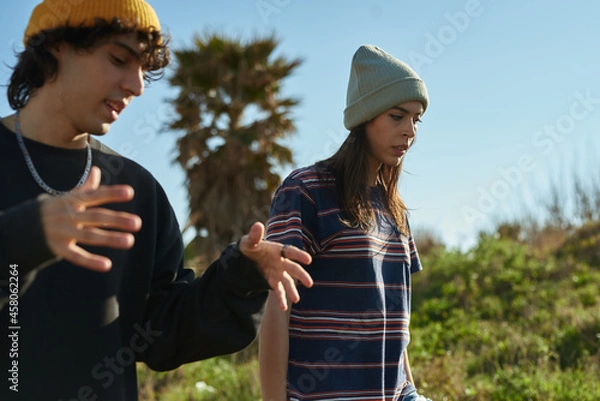 Obraz Two captivated young people in deep conversation