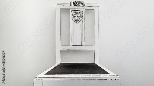 Obraz Rustic wooden chair painted by hand in white. Countryside decoration. Chair from the front in the picture with white wall in the background. Rustic and minimalist design.