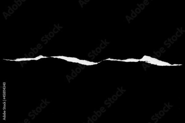 Fototapeta Paper tear, ripped paper edge, torn edge, isolated paper tear white on black, paper corner with space for copy