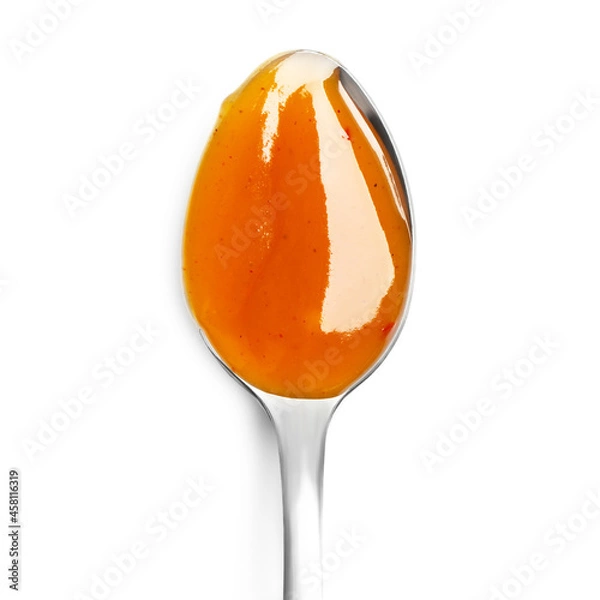 Obraz Chili sauce in spoon isolated on white background. Close up, top view.