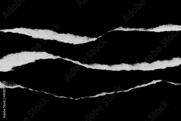 Fototapeta Paper tear, ripped paper edge, torn edge, isolated paper tear white on black, paper corner with space for copy