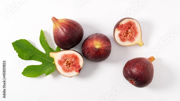 Obraz Figs and cut figs on a white background.