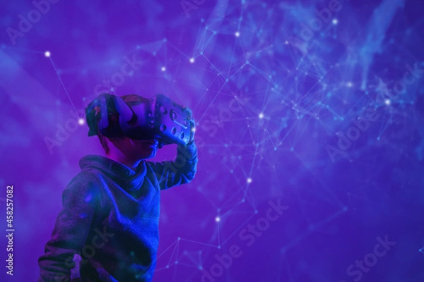 Fototapeta Child with virtual reality glasses in 3D environment