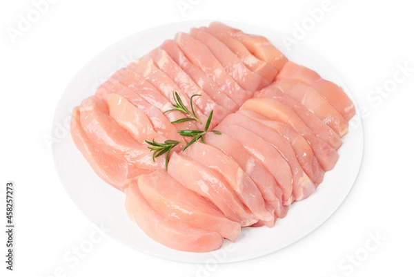 Obraz Raw chicken meat.Raw chicken medallions on a white plate on an isolated background with rosemary leaves. Raw chicken steaks.
