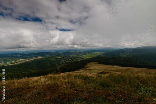 Obraz Cloudy sky over a mountain valley. Ukraine Eastern Bieszczady Carpathians.