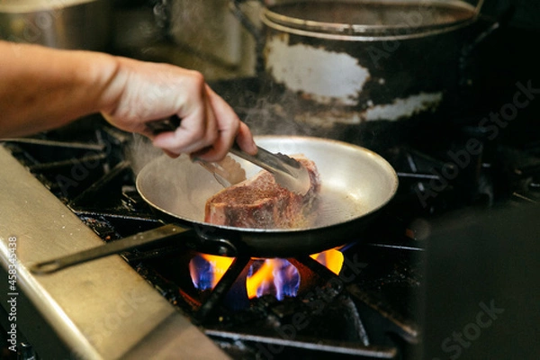 Fototapeta Chef cooking steak