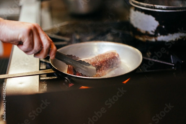 Fototapeta Chef cooking steak
